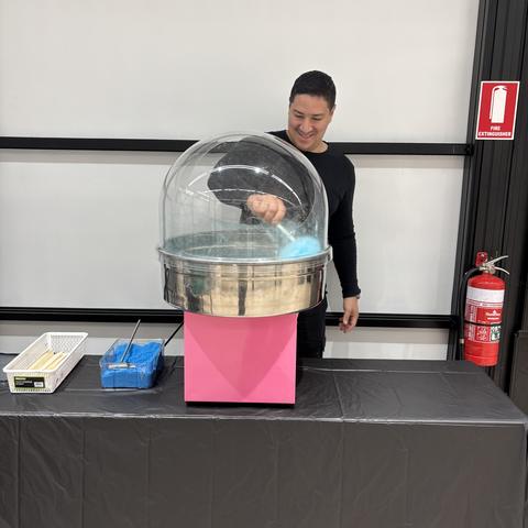 Spinning fresh fairy floss at an event